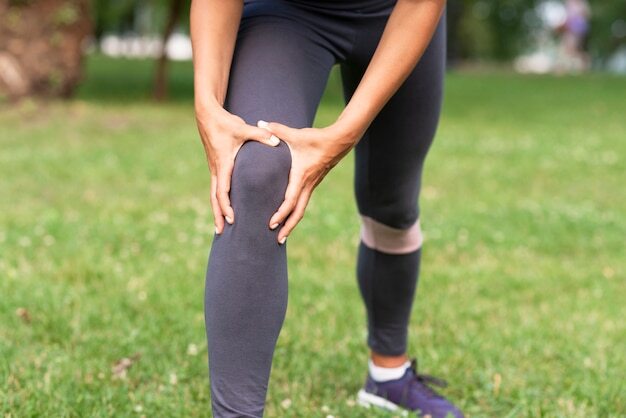 Close-up woman with knee ache