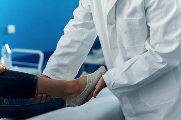 Close up of orthopedic examining foot of a woman at doctor's office