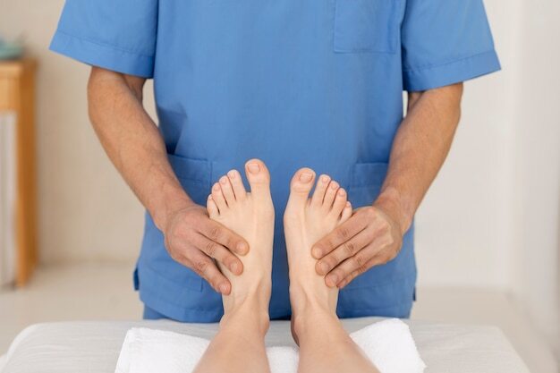 Nurse with patient in osteopathy session